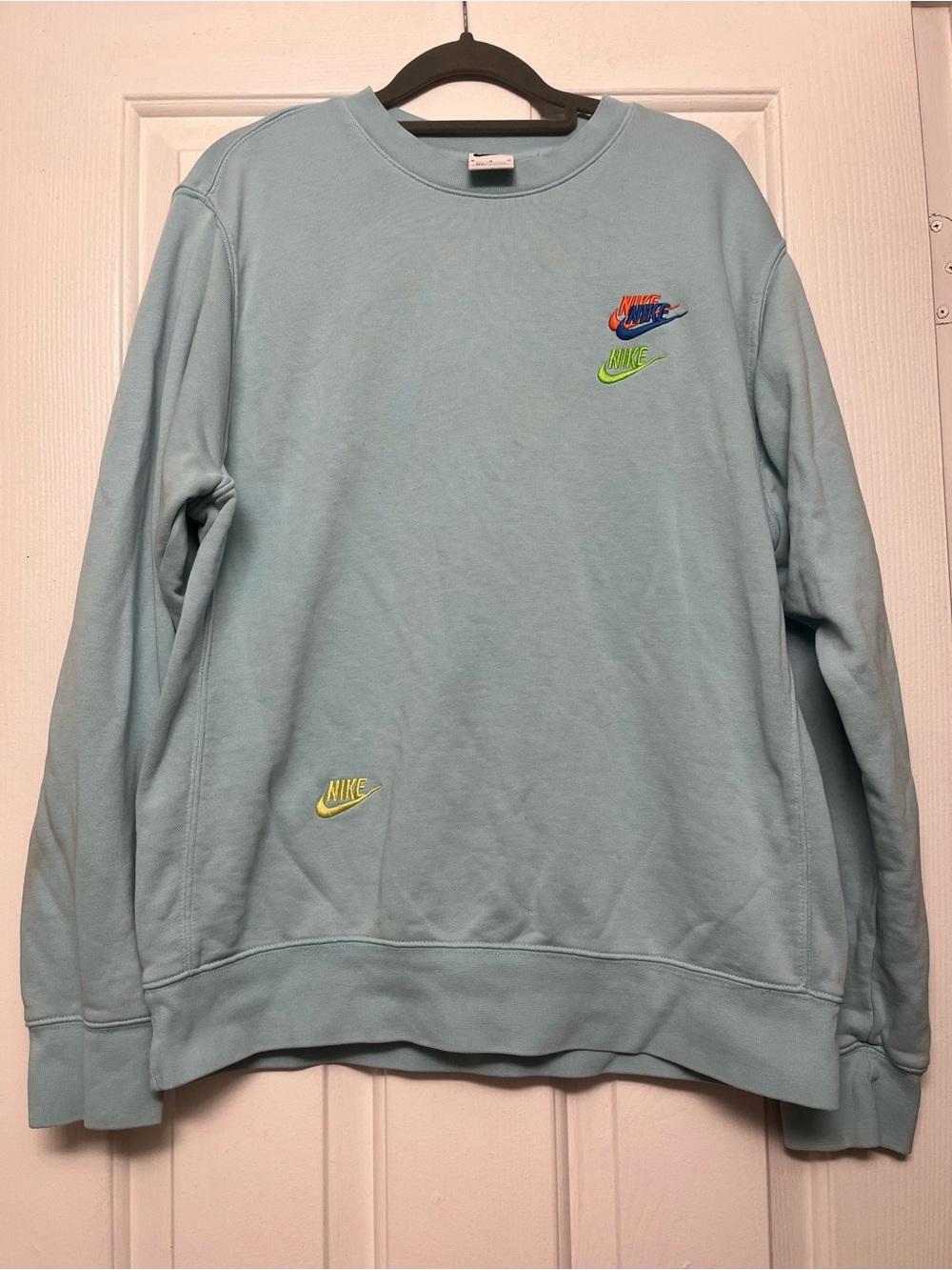 Nike Women’s Pale Blue Crewneck Sweatshirt with Multicolor Logos